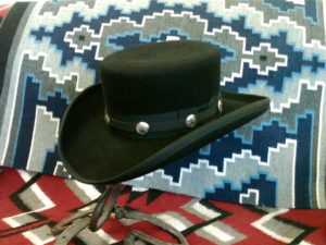 Replica James Caan hat from John Wayne movie El Dorado. Basic hat price for chosen felt plus $50 for hatband over ribbon with conchos.
